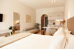 A bed or beds in a room at Ariadne Suites