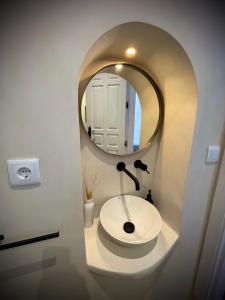a bathroom with a sink and a mirror at Casa Alta 22 in Frigiliana +54 photos