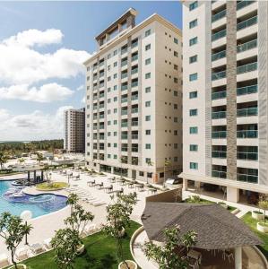 a view of a hotel with a pool and buildings at Salinas Park Resort in Salinópolis