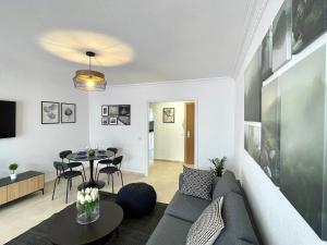a living room with a couch and a table at Beach Retreat 2 BR Apartment in Fuengirola
