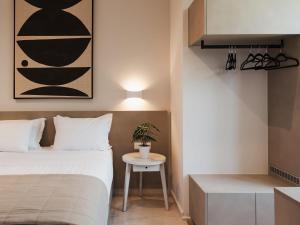A bed or beds in a room at Ariadne Suites