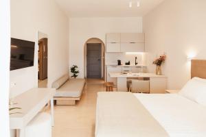 A bed or beds in a room at Ariadne Suites