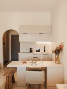 A kitchen or kitchenette at Ariadne Suites