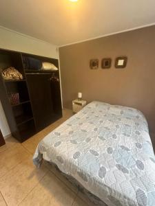 a bedroom with a bed and a walk in closet at Casa quinta Camino al Sol in Junín
