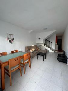 a living room with a table and a couch at Mabel in San Javier