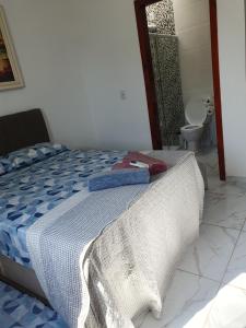 Ένα ή περισσότερα κρεβάτια σε δωμάτιο στο Quarto & Conforto