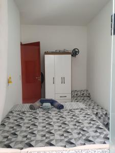 Ένα ή περισσότερα κρεβάτια σε δωμάτιο στο Quarto & Conforto