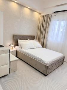 Ένα ή περισσότερα κρεβάτια σε δωμάτιο στο Cozy Staycation Studio in Iloilo by Alfasuite Iloilo