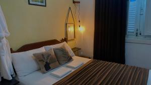 a bedroom with a bed with two pillows on it at Panorama Inn in Rio de Janeiro +51 photos