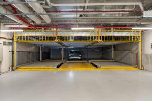 a parking lot with a car in a garage at Modern 1b Apt Near Swinburne University in Melbourne