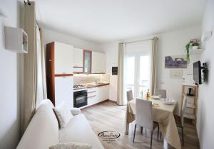 a living room with a white couch and a table at La Casetta in Tuglie