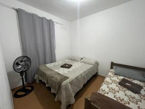 Postel nebo postele na pokoji v ubytování Plaza Shopping Guarus