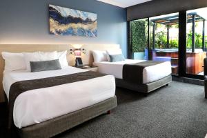 Postel nebo postele na pokoji v ubytování QUARTZ HOTEL & SPA