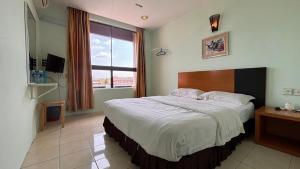 Postel nebo postele na pokoji v ubytování Hotel Centum