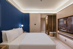 Μια τηλεόραση ή/και κέντρο ψυχαγωγίας στο Crystal Orange Shanghai Lujiazui Financial Center Hotel