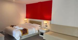 Postel nebo postele na pokoji v ubytování Midea Hotel 美的酒店 សណ្ឋាគារ មីឌា