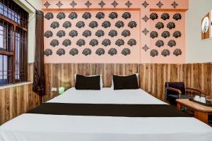 Postel nebo postele na pokoji v ubytování Super Hotel O Nand Palace