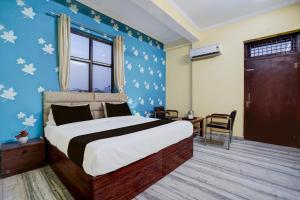 Postel nebo postele na pokoji v ubytování Super Hotel O Nand Palace