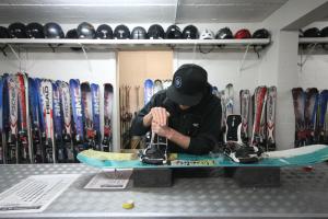 a man is working on a skateboard on a table at Arlberg Hotham in Mount Hotham