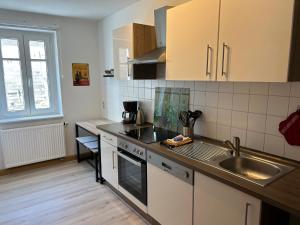 Kuchyň nebo kuchyňský kout v ubytování Sandstein-Ferien, FeWo "Biela", gemütlich, zentral, ruhig, Terrasse, Familienfreundl