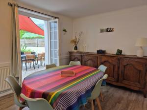 a dining room with a table with a purse on it at Pays Basque Gite Munhoa in Anhaux +27 photos