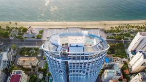 an aerial view of a building next to the ocean at LYN Panorama Nha Trang Condotel in Nha Trang
