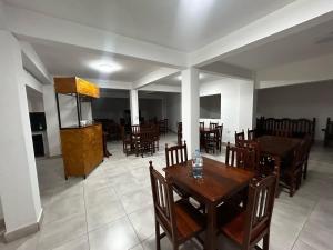 a dining room with a wooden table and chairs at Virginia hotel in La Quiaca