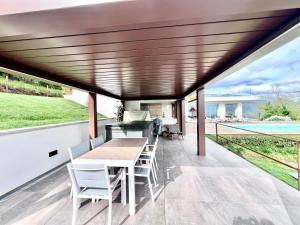 A balcony or terrace at Villa Olympia Pool Sea View Mountains Lake Nature Sleeps 8 Air Conditioning Wi-Fi