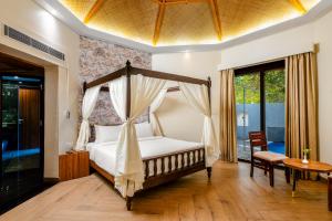 Voodi või voodid majutusasutuse Savitri Resort toas