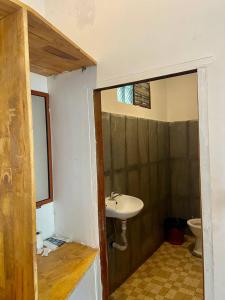 a bathroom with a sink and a toilet at Sweet Time Bungalows in Koh Rong Sanloem