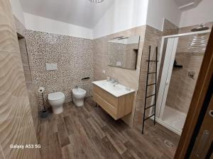 a bathroom with a sink and a toilet and a shower at La Casetta in Canadà Agerola Amalfi Coast in Agerola