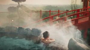 a person in a hot spring in a pool of water at Leng Ecopark Vangogh Hideaway in Kim Quan