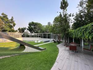 a view of a park with a slide at Luxury condo - BTS Punnawithi - Pool, Gym, Sauna in Amphoe Phra Khanong