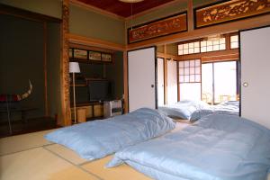Postel nebo postele na pokoji v ubytování 民泊-和-Guesthouse-wa-