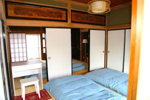 Postel nebo postele na pokoji v ubytování 民泊-和-Guesthouse-wa-