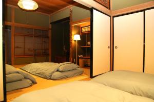 Postel nebo postele na pokoji v ubytování 民泊-和-Guesthouse-wa-