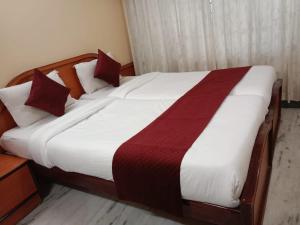 Letto o letti in una camera di Mysuru-hotel