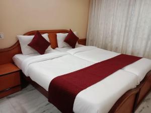Letto o letti in una camera di Mysuru-hotel