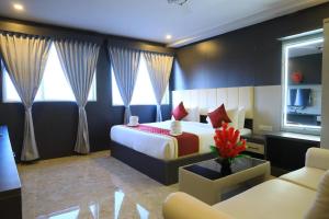 Postel nebo postele na pokoji v ubytování Hotel Brindavan Elite