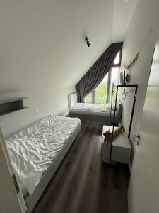 Ein Bett oder Betten in einem Zimmer der Unterkunft Ostsee - Reetdachhaus Nr 42 "Waterkant" im Strand Resort