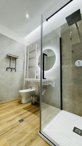 a bathroom with a glass shower and a tub at I Racconti del Fiume in Bussi sul Tirino +52 photos