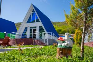 a toy duck sitting on top of a tree stump at Mirvari Aframe in Quba
