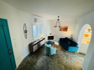 a living room with a couch and a table at Beach House Batsi in Batsi