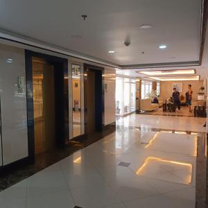 a lobby of an office building with people sitting at Time to Smile & Relax in Baguio +29 photos