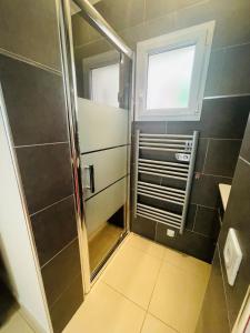 a small bathroom with a shower and a window at A Hilltop Haven in Lumio - Sea View and Cascading Terraces in Lumio