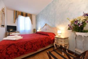 Łóżko lub łóżka w pokoju w obiekcie Locanda Casa Martini