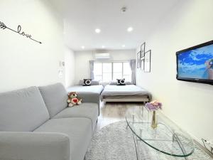 TV a/nebo společenská místnost v ubytování guesthouse Nakatsu