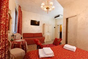 Telewizja i/lub zestaw kina domowego w obiekcie Locanda Casa Martini