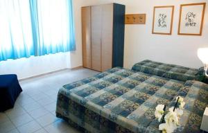 Postel nebo postele na pokoji v ubytování Albergo Rossella