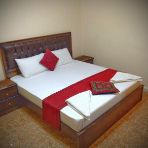 Postelja oz. postelje v sobi nastanitve Majido Hotel